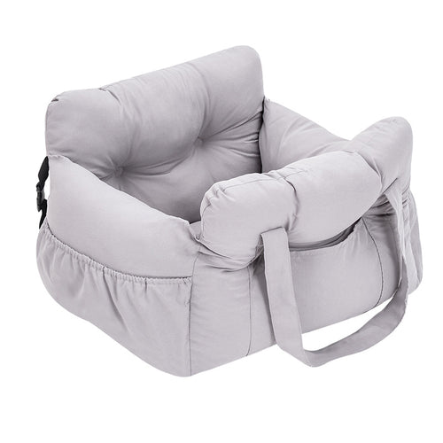 A grey dog seat with cushion on a white background