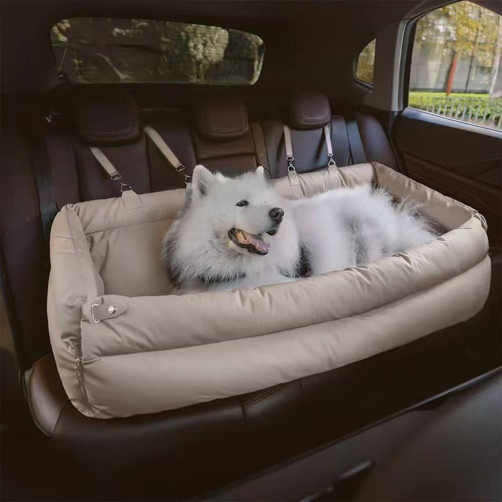 Dog lying in a pet car sofa inside a car