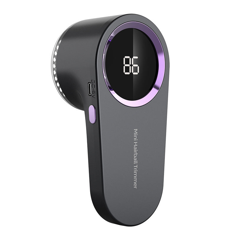 Black and purple electronic Pet hair remover. device with digital display on a white background