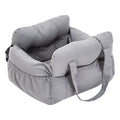 A grey dog's seat with headrest on a white background