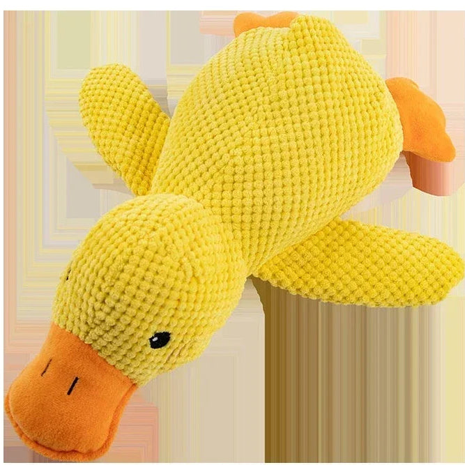 Yellow plush duck toy with an orange beak on a light background