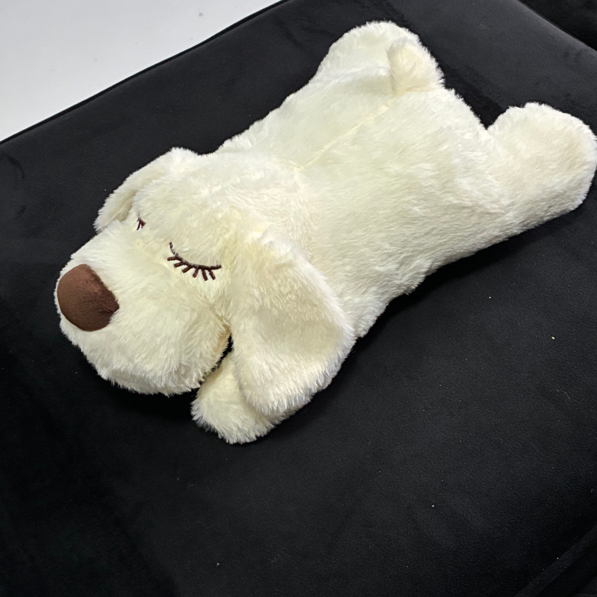 White plush dog heartbeat toy side view showing soft texture